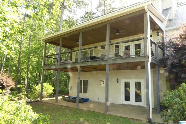 rear view of house with a patio, a balcony, and a ceiling fan