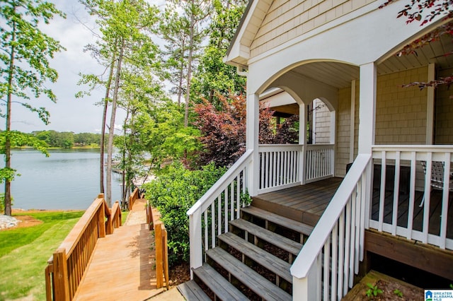 wooden deck with a water view
