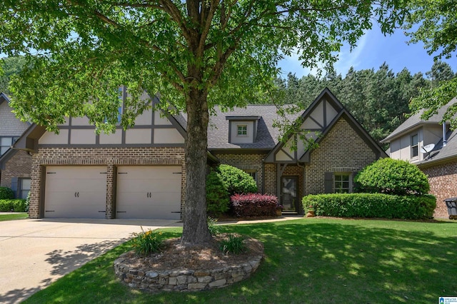 tudor home featuring brick siding, concrete driveway, and a front lawn