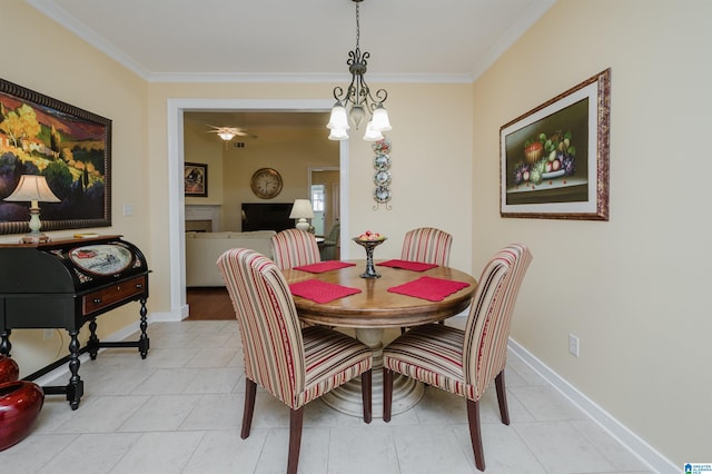 dining area with ornamental molding, baseboards, light tile patterned floors, and a chandelier