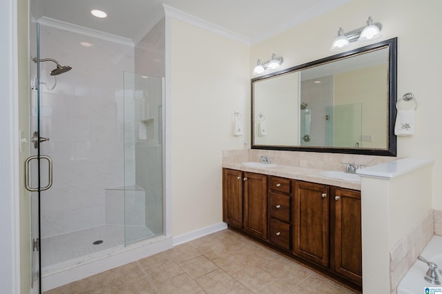 bathroom featuring ornamental molding, a shower stall, tile patterned floors, and double vanity