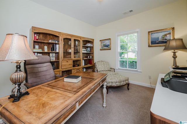 office space with carpet and baseboards
