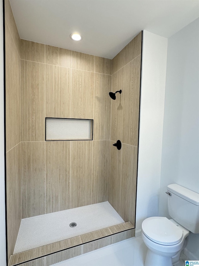2309 28th St, Birmingham, AL 35208 - bathroom featuring toilet, tiled shower, recessed lighting, and tile patterned floors