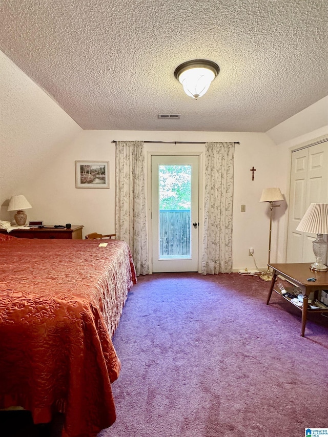 carpeted bedroom with access to exterior, lofted ceiling, and a textured ceiling