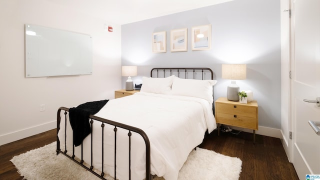 1801 2nd Ave N Unit 201, Birmingham, AL 35203 - bedroom featuring wood finished floors and baseboards