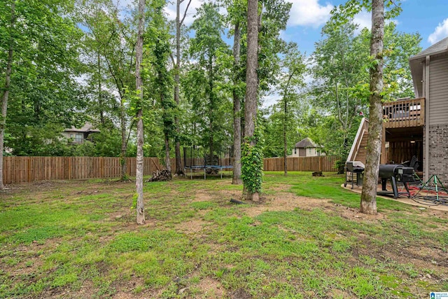 984 Knobloch Ln, Moody, AL 35004 - view of yard featuring a trampoline, stairway, and a wooden deck