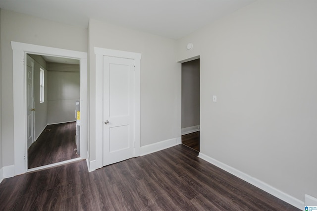 unfurnished room with wood finished floors and baseboards