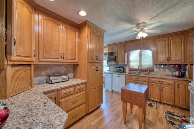 179 Idlewood Cir, Alexandria, AL 36250 - kitchen featuring a sink, dishwasher, a ceiling fan, backsplash, and a textured ceiling