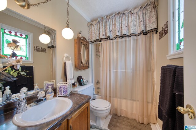 179 Idlewood Cir, Alexandria, AL 36250 - full bath featuring crown molding, tile patterned floors, vanity, toilet, and plenty of natural light