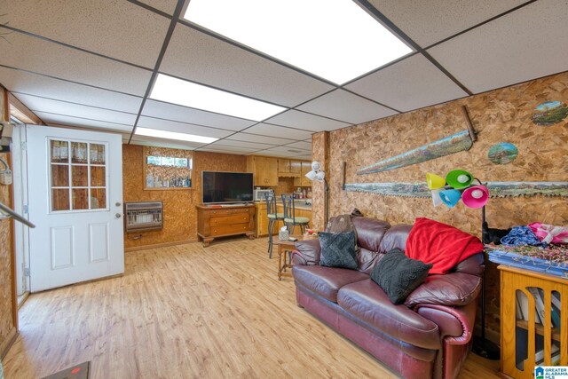 179 Idlewood Cir, Alexandria, AL 36250 - living area featuring heating unit, a paneled ceiling, and wood finished floors