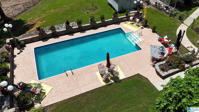 179 Idlewood Cir, Alexandria, AL 36250 - view of pool with a lawn and a patio area