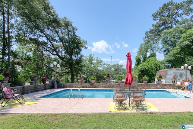 179 Idlewood Cir, Alexandria, AL 36250 - view of swimming pool with a patio and a yard