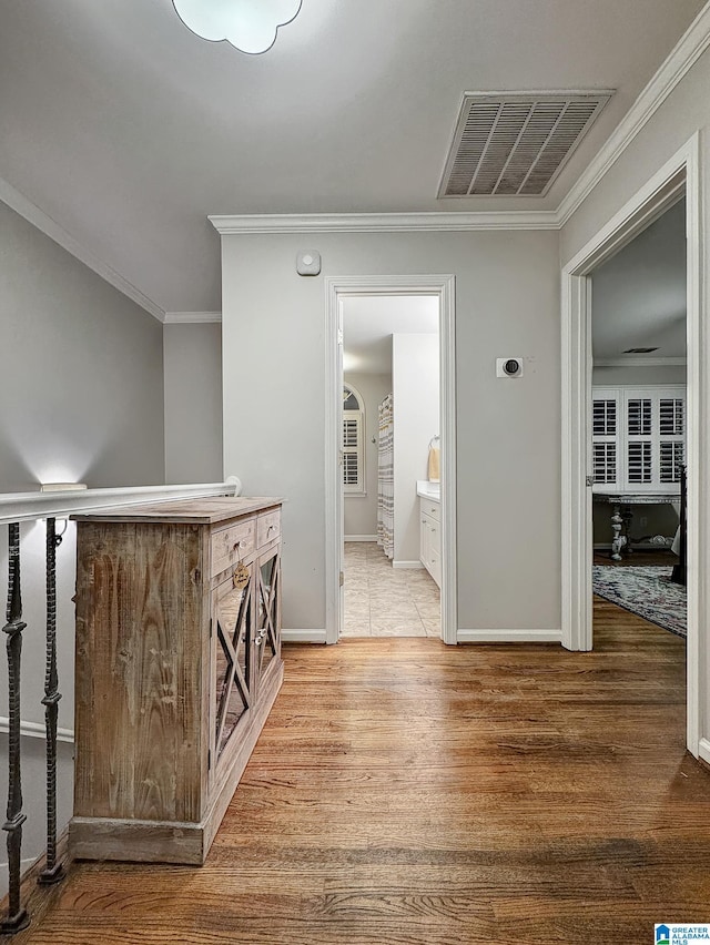 1851 Russet Woods Ln, Hoover, AL 35244 - hall featuring light wood-type flooring, ornamental molding, and baseboards