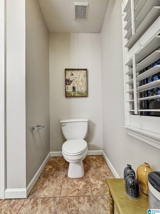 1851 Russet Woods Ln, Hoover, AL 35244 - bathroom featuring baseboards and toilet