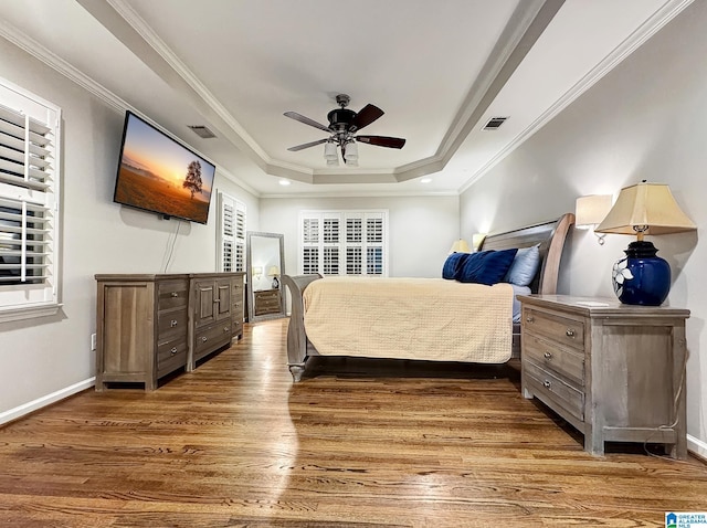 1851 Russet Woods Ln, Hoover, AL 35244 - bedroom with a tray ceiling, wood finished floors, ornamental molding, baseboards, and ceiling fan