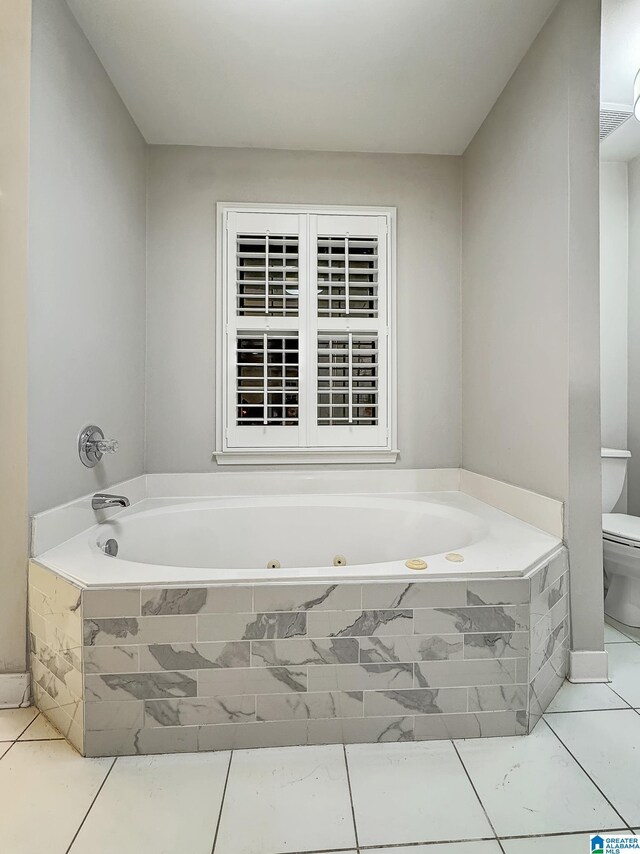 1851 Russet Woods Ln, Hoover, AL 35244 - bathroom with toilet, a tub with jets, and tile patterned flooring