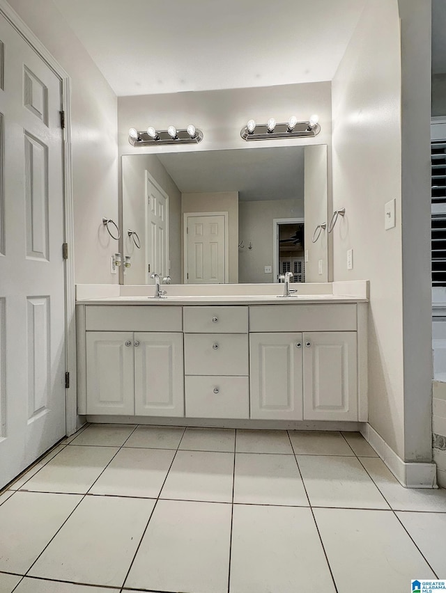 1851 Russet Woods Ln, Hoover, AL 35244 - full bathroom with double vanity, tile patterned floors, and baseboards