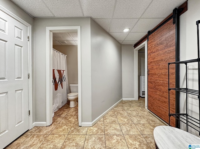 1851 Russet Woods Ln, Hoover, AL 35244 - bathroom featuring toilet, tile patterned flooring, a drop ceiling, baseboards, and a shower with curtain