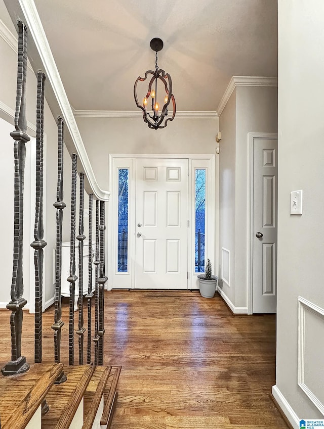 1851 Russet Woods Ln, Hoover, AL 35244 - foyer entrance with a chandelier, wood finished floors, ornamental molding, and baseboards
