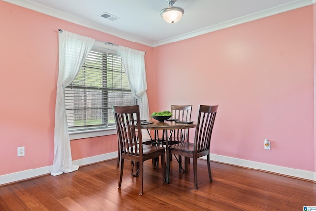 142 Falling Waters Ln, Maylene, AL 35114 - dining area featuring baseboards, crown molding, and wood finished floors
