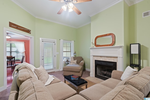142 Falling Waters Ln, Maylene, AL 35114 - living area with ornamental molding, carpet floors, healthy amount of natural light, a ceiling fan, and a fireplace