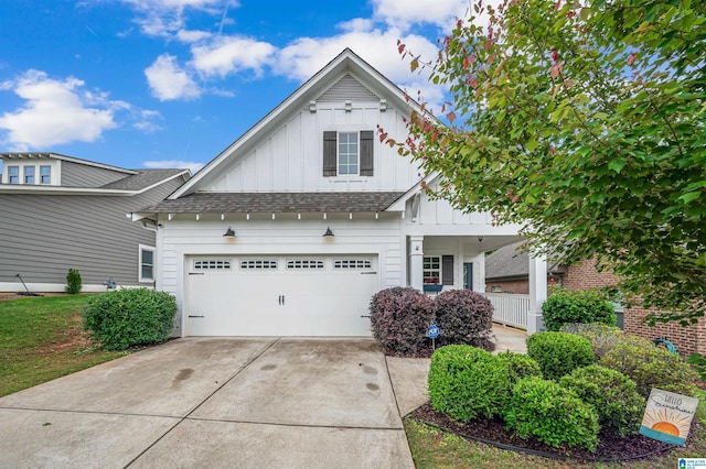3951 Crest Lndg, Irondale, AL 35210 - view of front of home featuring board and batten siding, concrete driveway, and a shingled roof