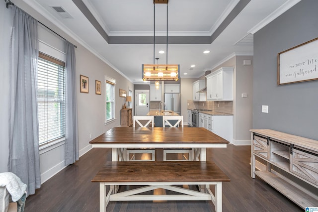 3951 Crest Lndg, Irondale, AL 35210 - dining room featuring dark wood-style flooring, a raised ceiling, ornamental molding, baseboards, and recessed lighting