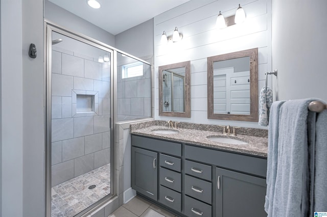 3951 Crest Lndg, Irondale, AL 35210 - full bath with a shower stall, double vanity, and tile patterned floors
