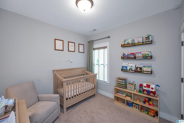 3951 Crest Lndg, Irondale, AL 35210 - bedroom with carpet flooring, baseboards, and a crib