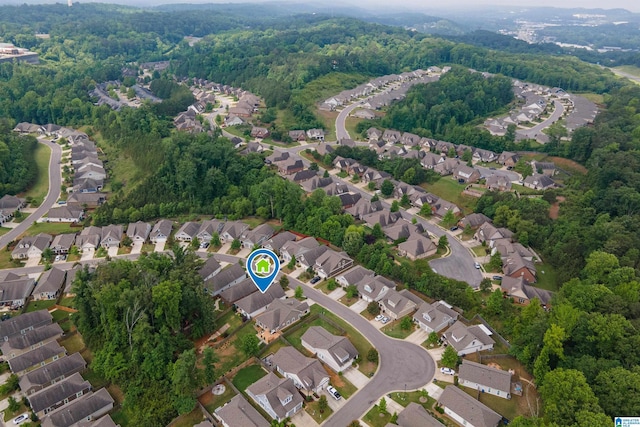 3951 Crest Lndg, Irondale, AL 35210 - aerial view of property and surrounding area with nearby suburban area and a heavily wooded area