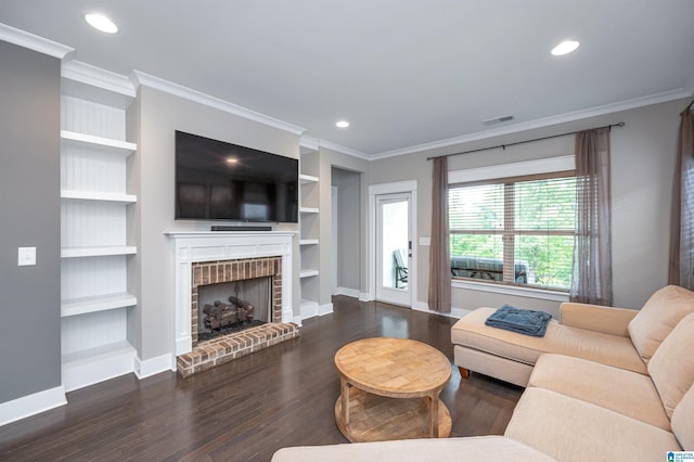 3951 Crest Lndg, Irondale, AL 35210 - living room with ornamental molding, baseboards, wood finished floors, a fireplace, and built in features