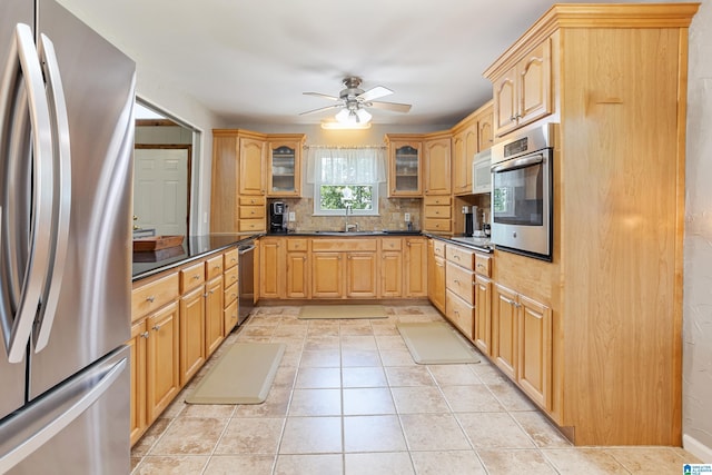 14 Shades Crest Rd, Hoover, AL 35226 - kitchen featuring appliances with stainless steel finishes, a sink, a ceiling fan, glass insert cabinets, and dark countertops