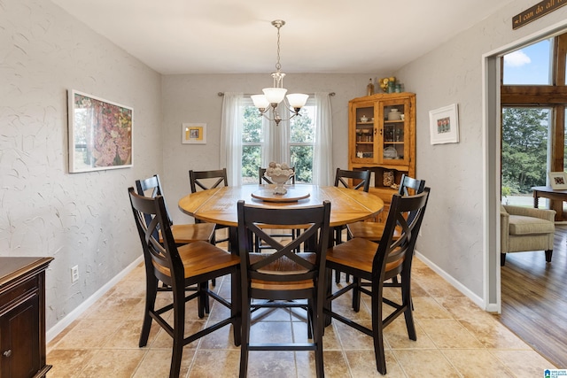 14 Shades Crest Rd, Hoover, AL 35226 - dining room featuring a chandelier, baseboards, and a textured wall