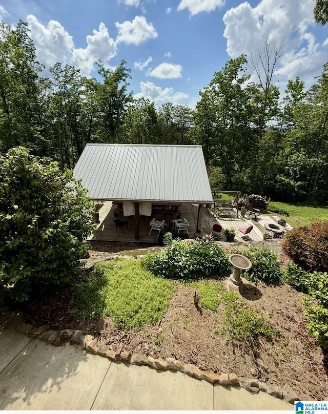 14 Shades Crest Rd, Hoover, AL 35226 - view of home's exterior featuring metal roof and a patio area