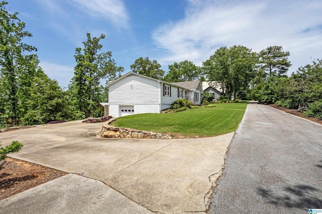 14 Shades Crest Rd, Hoover, AL 35226 - view of property exterior featuring driveway, an attached garage, and a lawn