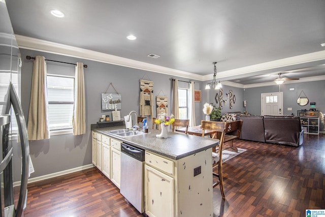 624 Enclave Ln, Calera, AL 35040 - kitchen featuring stainless steel dishwasher, a sink, a peninsula, dark wood-style floors, and healthy amount of natural light