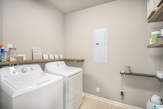 624 Enclave Ln, Calera, AL 35040 - clothes washing area with separate washer and dryer, light tile patterned floors, and baseboards