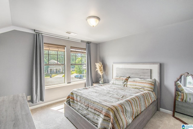624 Enclave Ln, Calera, AL 35040 - carpeted bedroom with baseboards and vaulted ceiling