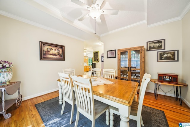 8526 Scenic Ridge Dr, Pinson, AL 35126 - dining space featuring wood finished floors, a ceiling fan, crown molding, and baseboards