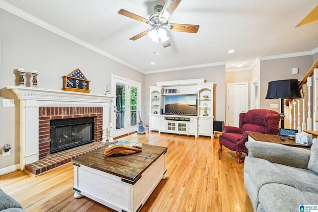 8526 Scenic Ridge Dr, Pinson, AL 35126 - living area with a ceiling fan, light wood-type flooring, a brick fireplace, recessed lighting, and stairway