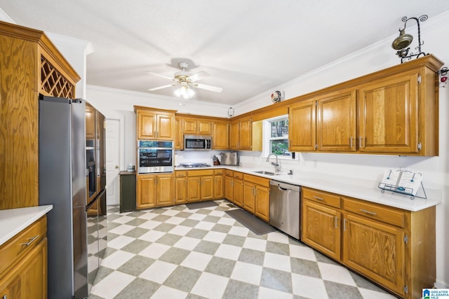 8526 Scenic Ridge Dr, Pinson, AL 35126 - kitchen featuring appliances with stainless steel finishes, a sink, light flooring, ceiling fan, and brown cabinetry
