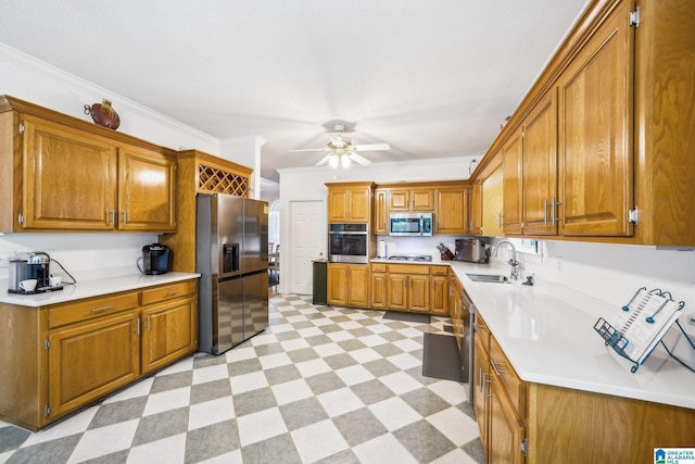 8526 Scenic Ridge Dr, Pinson, AL 35126 - kitchen with appliances with stainless steel finishes, a sink, light flooring, brown cabinetry, and light countertops