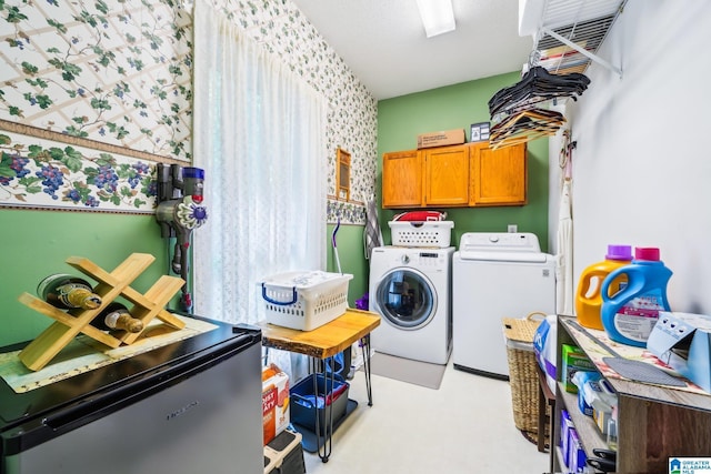 8526 Scenic Ridge Dr, Pinson, AL 35126 - washroom with separate washer and dryer, cabinet space, and wallpapered walls