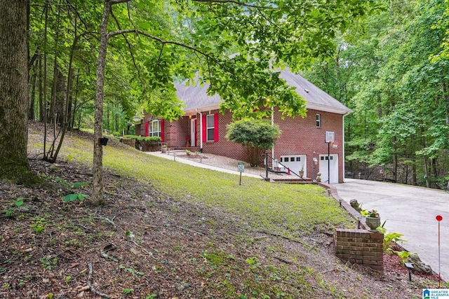 8526 Scenic Ridge Dr, Pinson, AL 35126 - view of front of property featuring an attached garage, brick siding, concrete driveway, and a front yard