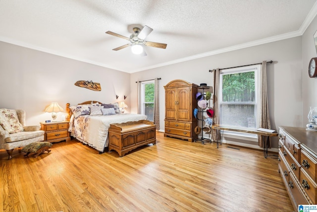 8526 Scenic Ridge Dr, Pinson, AL 35126 - bedroom with light wood-type flooring, crown molding, a textured ceiling, and a ceiling fan