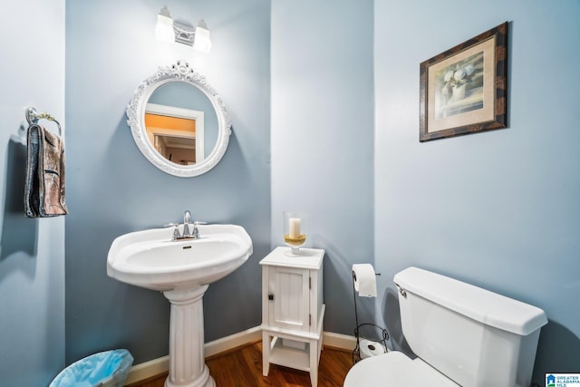 8526 Scenic Ridge Dr, Pinson, AL 35126 - bathroom with toilet, wood finished floors, and baseboards