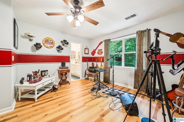 8526 Scenic Ridge Dr, Pinson, AL 35126 - rec room featuring ceiling fan, wood finished floors, a textured ceiling, and baseboards