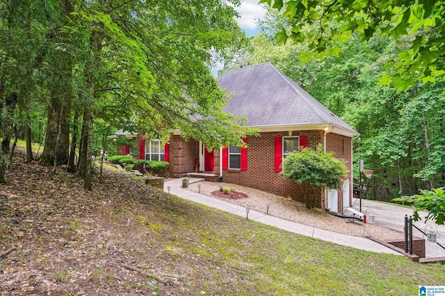 8526 Scenic Ridge Dr, Pinson, AL 35126 - view of front of home with brick siding, a shingled roof, a garage, and a front lawn