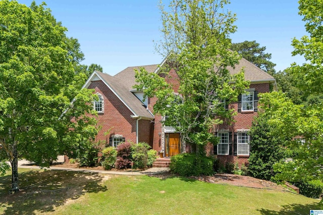 1051 Oak Meadows Rd, Birmingham, AL 35242 - view of front of house featuring brick siding, a front lawn, and roof with shingles