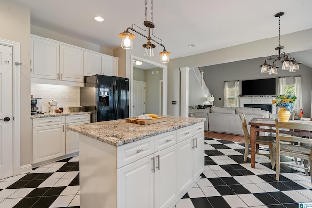1051 Oak Meadows Rd, Birmingham, AL 35242 - kitchen with black refrigerator with ice dispenser, a kitchen island, backsplash, white cabinets, and recessed lighting